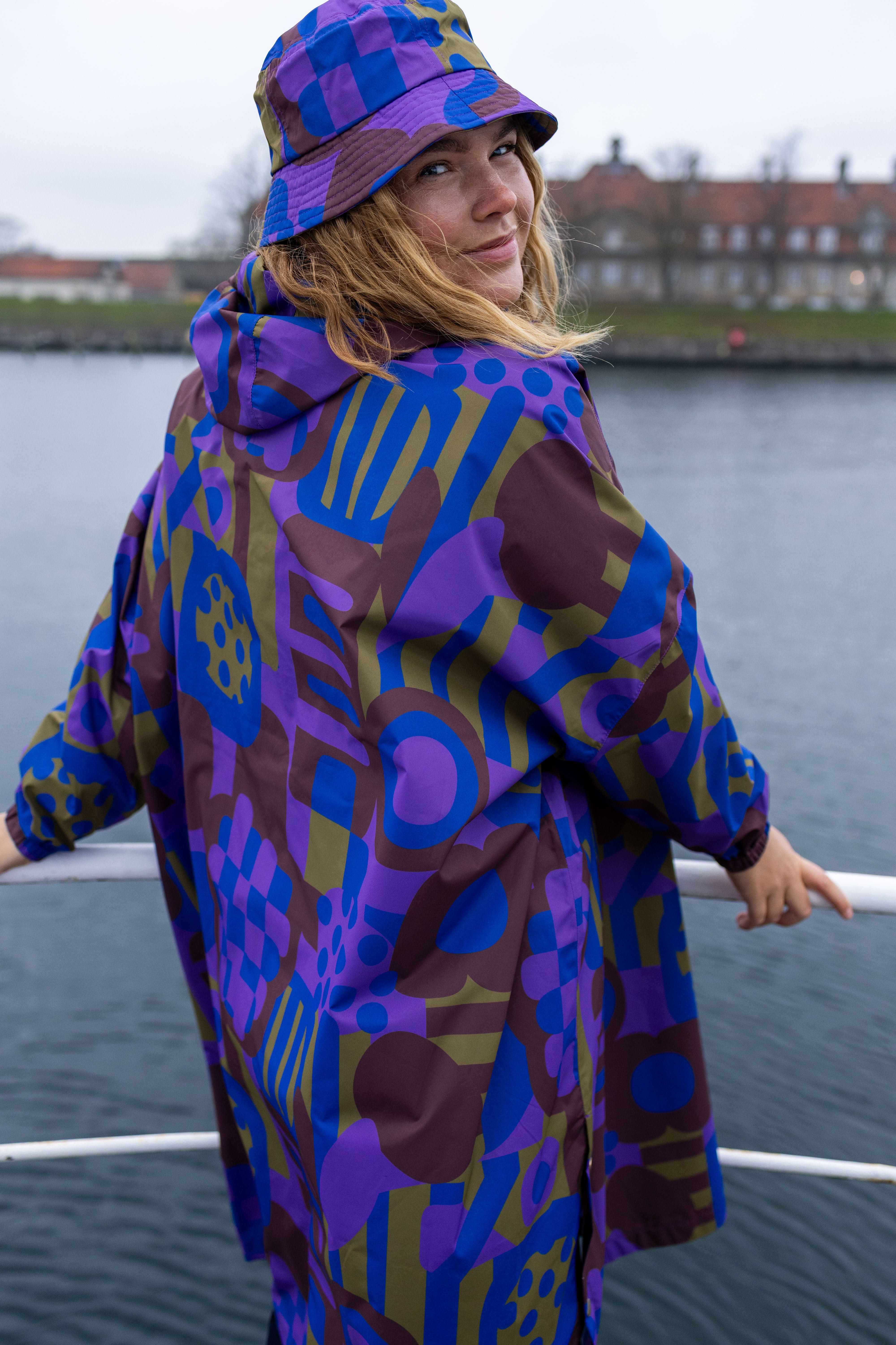 DaneDreamdrops_RainPoncho_Purple_Patchland side